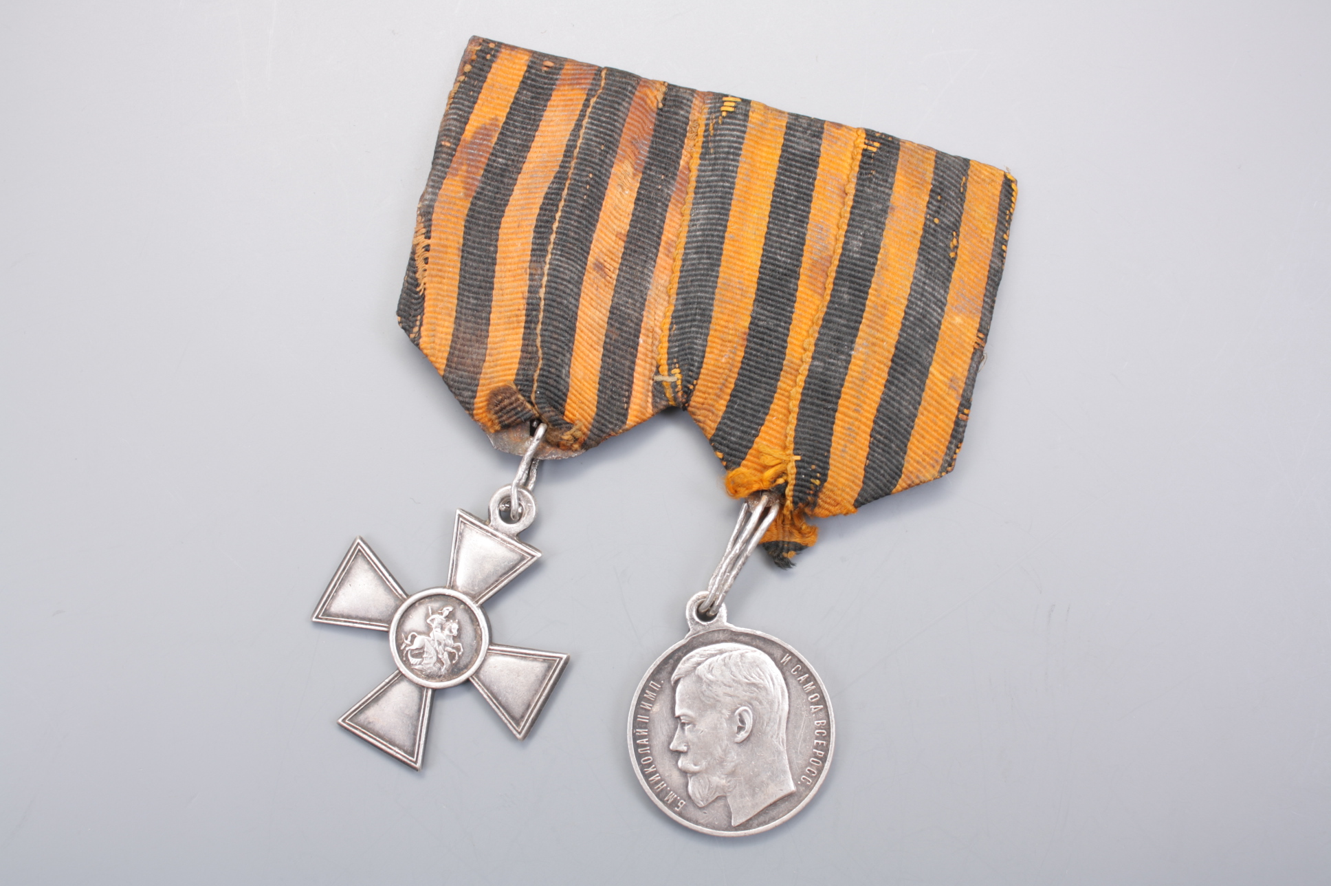 Медаль "За Храбрость" 4-й степени и Георгиевский Крест 4-й степени на оригинальной колодке, Российская Империя.